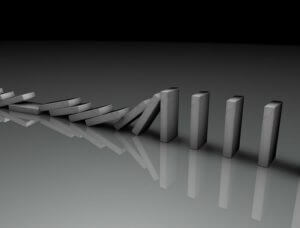 Dominoes falling over.