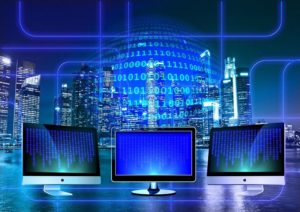 Data flows on different computer monitors.